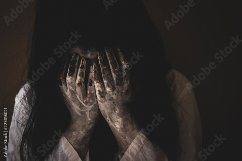 Fotografie Black long hair women monster crying close up.