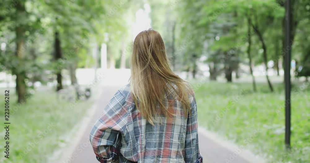 A girl is resting outdoors. A girl is resting outdoors.