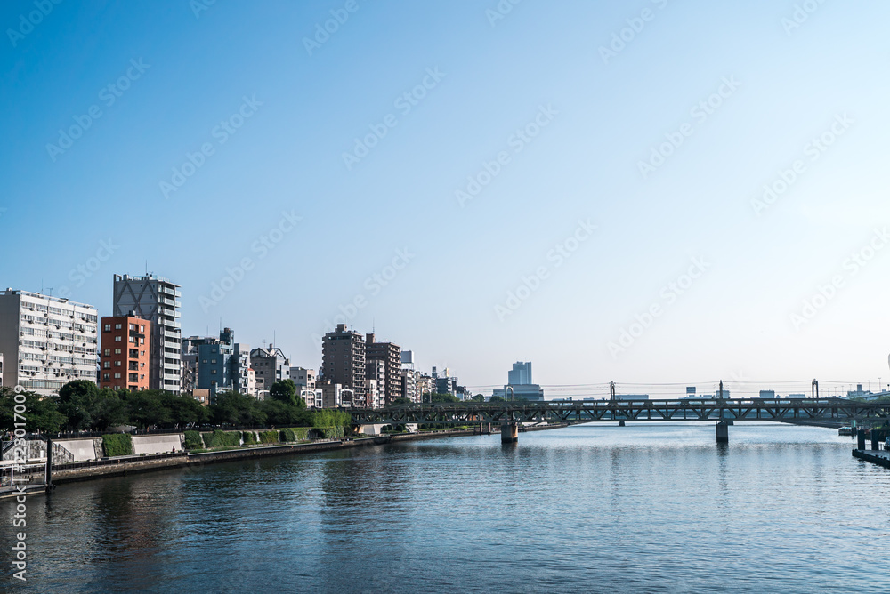 TOKYO, JAPAN - June 22, 2018: Tokyo Railway bridge and blue sky.