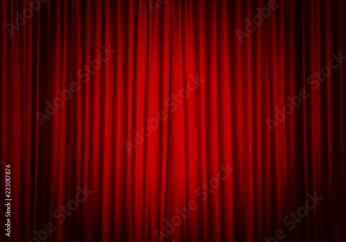 Closed red curtain background and spotlight. Theatrical drapes. photo