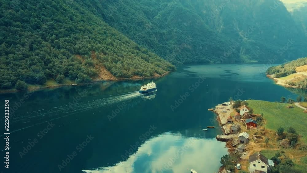 Aerial View boat and river mountain peaks landscape view Norway, in summer sunny day with blue sky Aerial View boat and river mountain peaks landscape view Norway, in summer sunny day with blue sky