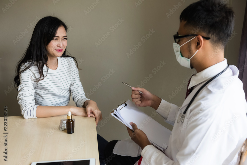 Asian doctor diagnose patiient woman in hospital Asian doctor diagnose patiient woman in hospital