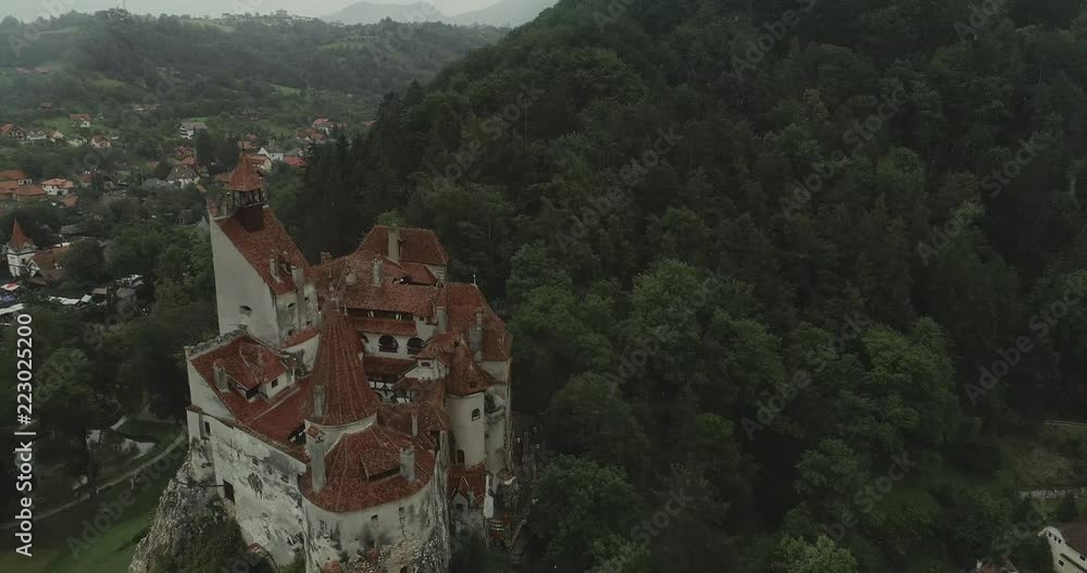 Aerial view of a castle on a rainy weather with overcast sky. Aerial view of a castle on a rainy weather with overcast sky.