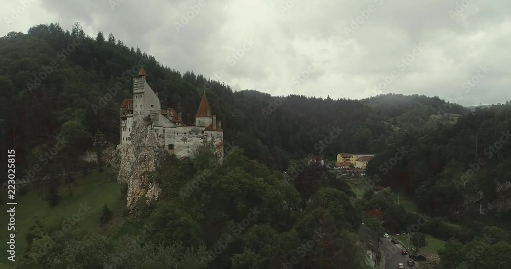 Aerial view of a castle on a rainy weather with overcast sky. Aerial view of a castle on a rainy weather with overcast sky.