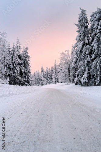 A slippery and dangerous mountain snowy road at dawn. © jpr03