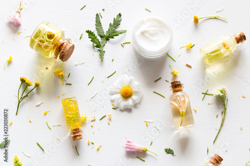 natural cosmetics for face and body care from wildflowers close-up on a white background