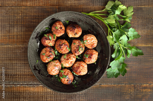 Fried meatballs and fresh parsley photo