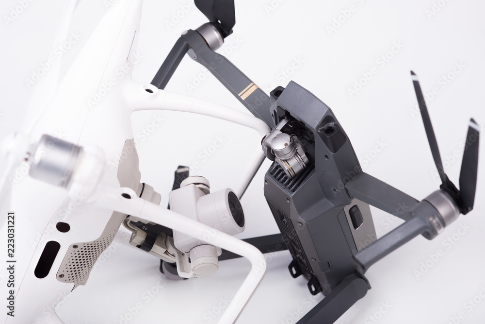 Flying drones with video camera on a white background. Flying drones with video camera on a white background.