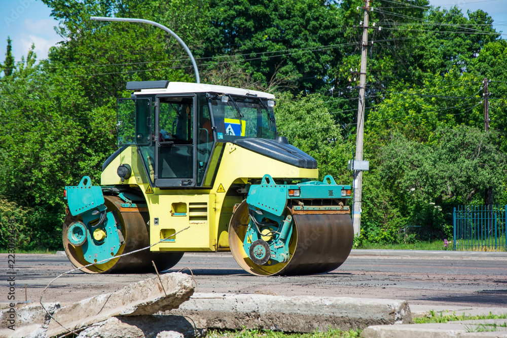 Light Vibration roller compactor at road construction and repairing asphalt, pavement works Light Vibration roller compactor at road construction and repairing asphalt, pavement works