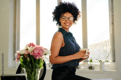 Woman having coffee break at work