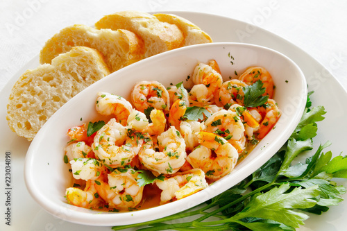 scampi fried in garlic butter and olive oil with parsley and bread