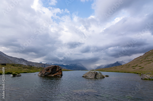 Lake Stellisee with a view of the Matterhorn in the clouds