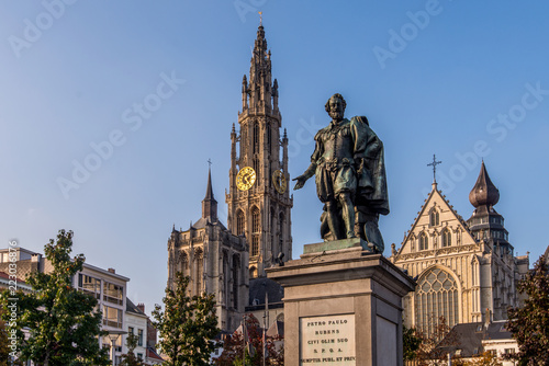Statue of Pieter Paul Rubens with the Cathedral of our Lady in the background in Antwerp, Belgium photo