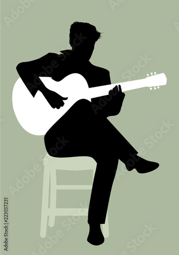 Silhouette of Spanish guitarist playing flamenco sitting on a chair