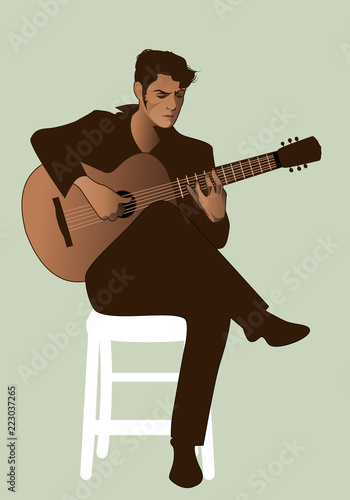 Spanish guitarist playing flamenco sitting on a chair