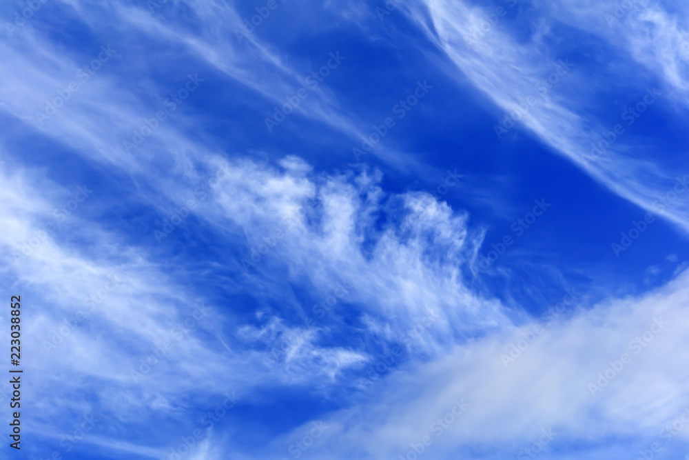 background - blue day sky with white cirrus clouds background - blue day sky with white cirrus clouds