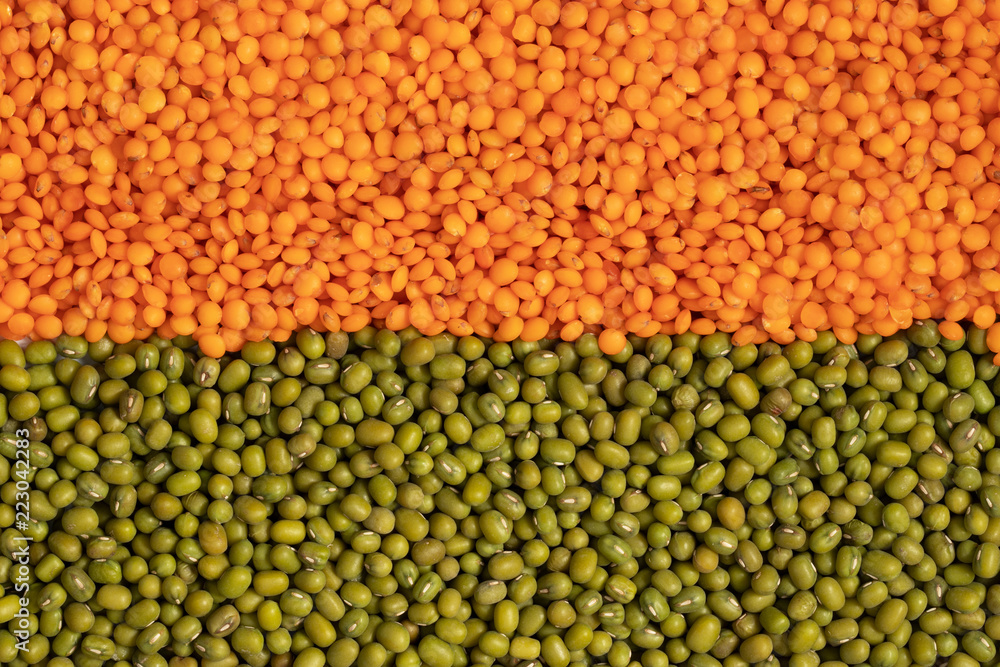 Orange and green lentils full background, top view
