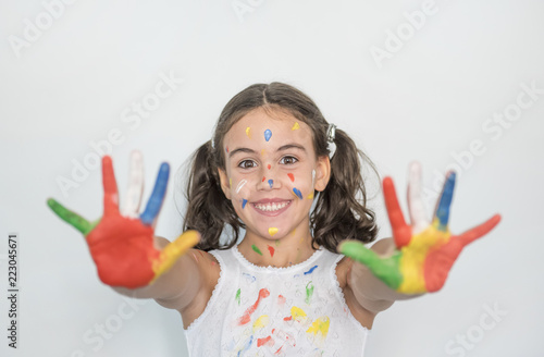 little girl smeared with paints