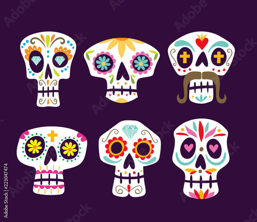 Colorful mexican skull collection. Cute cartoon sugar skulls isolated on purple background. Set 1 of 2. Vector illustration.