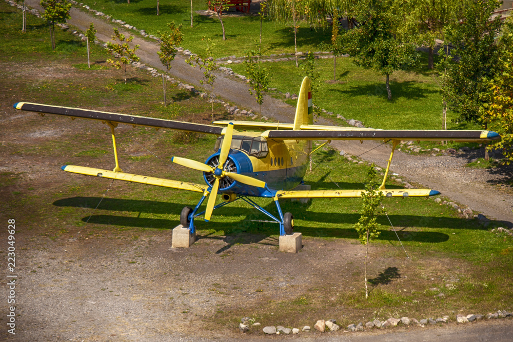 Blue yellow airplane with hungarian flag and landscape background. Blue yellow airplane with hungarian flag and landscape background.