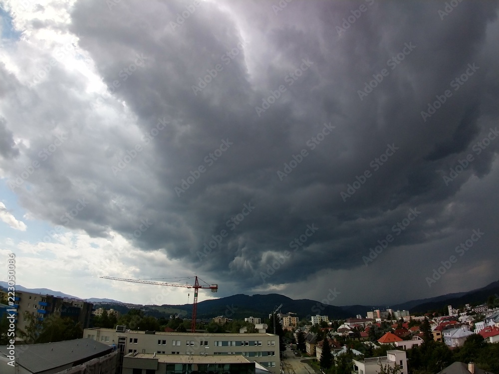 Heavy storm clouds and strong wind over the town. Slovakia