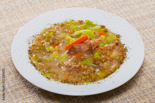 Thick mutton soup with green peas