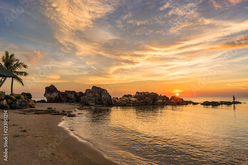 Phu Quoc island coastline on warm colorful scenic sunset with clouds on sky