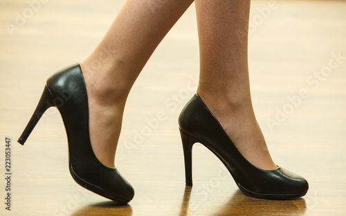 Unrecognizable woman wearing high heels