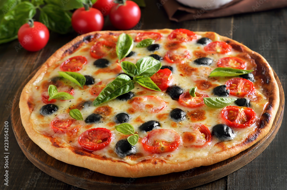 Homemade pizza with tomato and olives