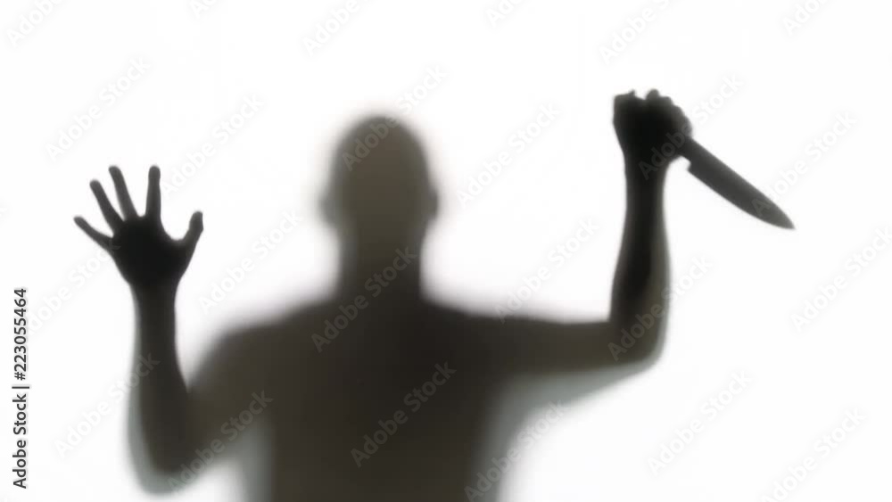 Silhouette of a knife wielding killer. Great for Halloween. Silhouette of a knife wielding killer. Great for Halloween.