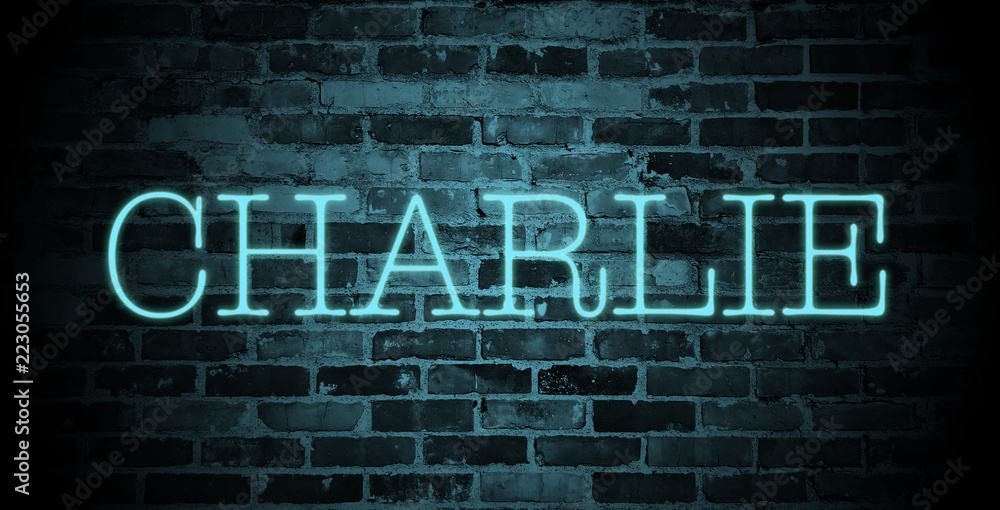 Fototapeta premium first name charlie in blue neon on brick wall
