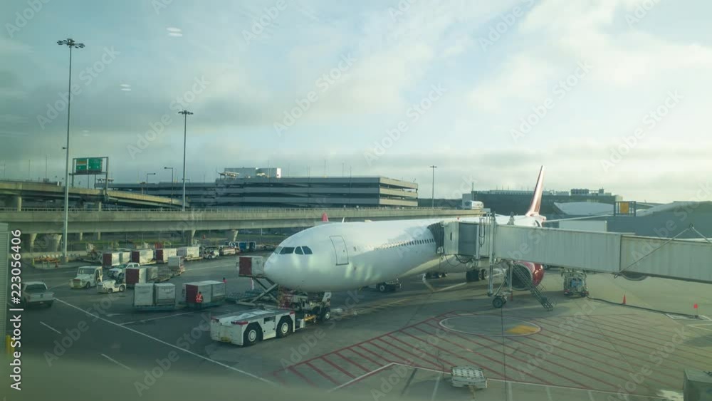 time-lapse busy ground crew load and refuel a plane while at departure gate time-lapse busy ground crew load and refuel a plane while at departure gate