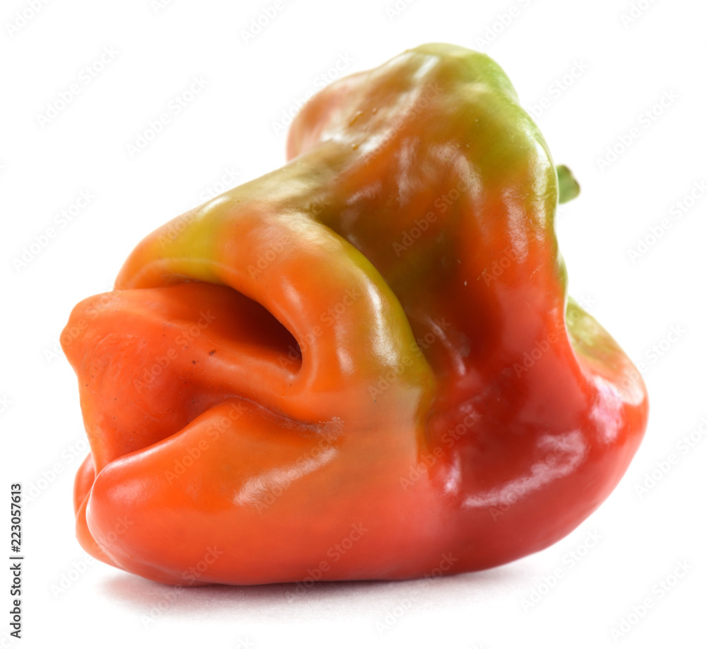 Natural organic food. Deformed homegrown sweet pepper isolated on white Natural organic food. Deformed homegrown sweet pepper isolated on white