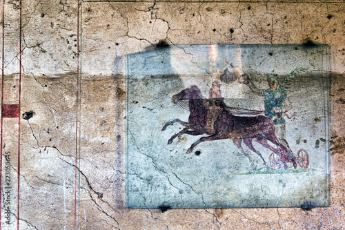 Fresco with the Aurighi in a corridor of the Aurighi tenement in the archaeological excavations of Ancient ostia - Rome © Equatore