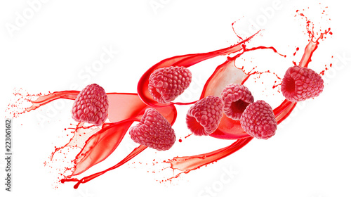 raspberries in juice splash on a white background