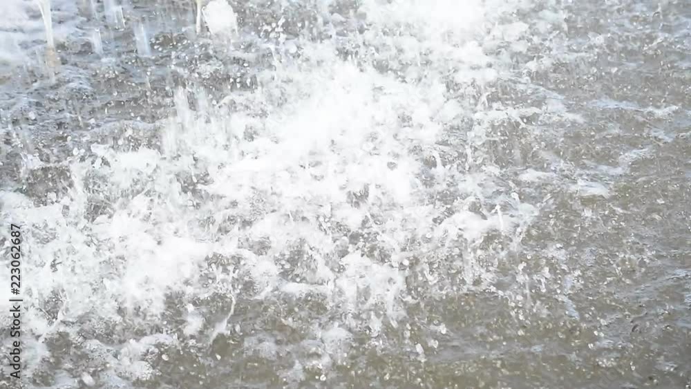 Water drops splashing on water surface Water drops splashing on water surface