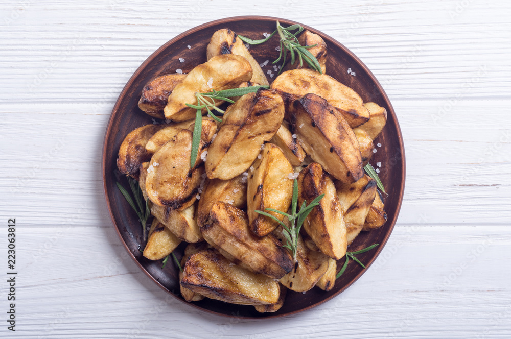 Homemade grilled potatoes with rosemary Homemade grilled potatoes with rosemary