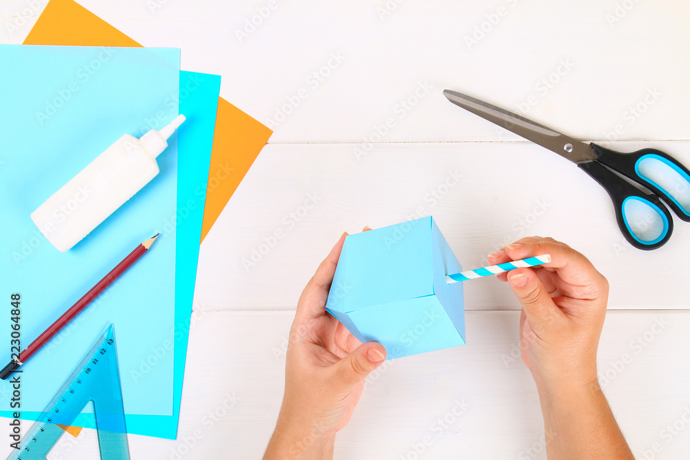 DIY. Paper dreidel with his own hands made of paper. Sevivon to the Jewish holiday of Hanukkah. Handmade toy for the child. DIY. Paper dreidel with his own hands made of paper. Sevivon to the Jewish holiday of Hanukkah. Handmade toy for the child.