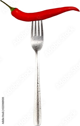 Chili pepper on a fork - isolated image