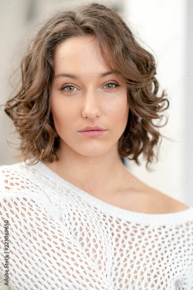 Portrait of girl in white sweater Portrait of girl in white sweater