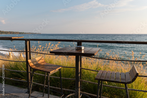Table and chairs by the sea