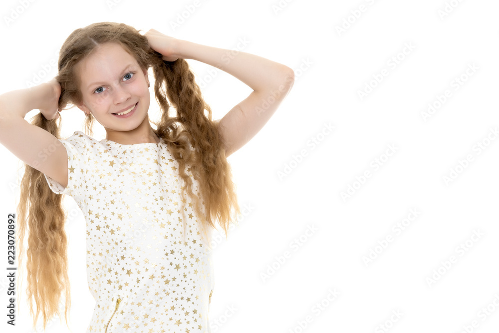 A teenage girl in a short dress. A teenage girl in a short dress.