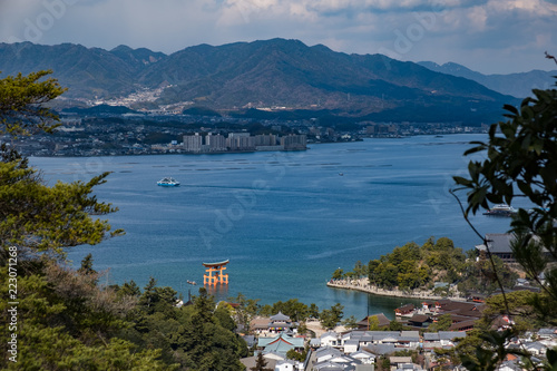 Aerial view of giant red torii of Itsukushima Shrine on Miyajima, Japan at daytime