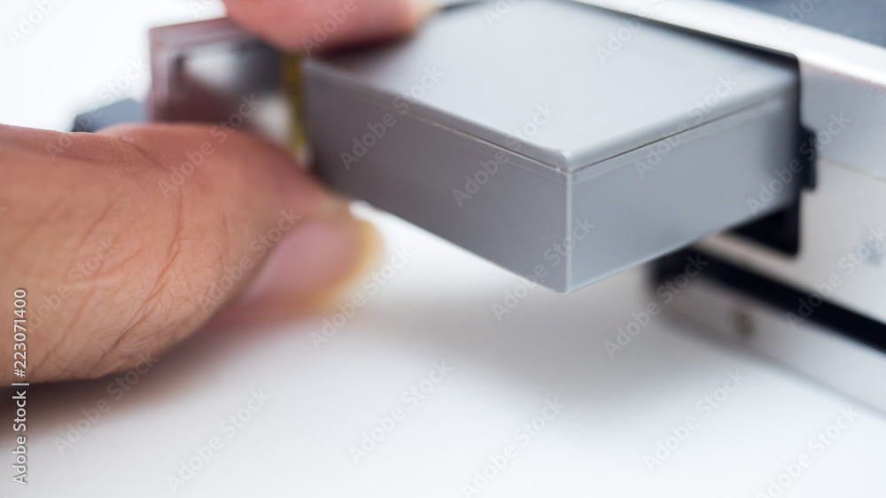 finger with battery camera close up finger with battery camera close up