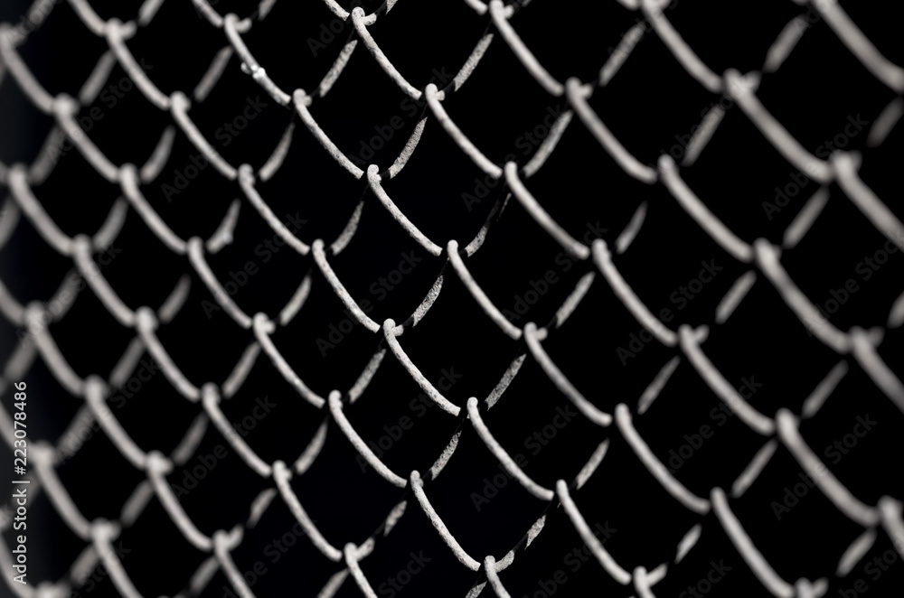 Fototapeta premium Metal fence on a black background
