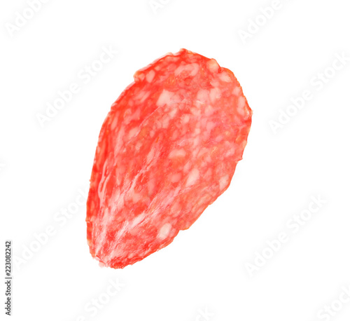 Slice of tasty salami on white background