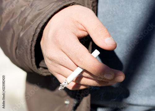 cigarettes in close-up hands