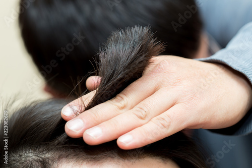 hairdresser cutting customer's hair