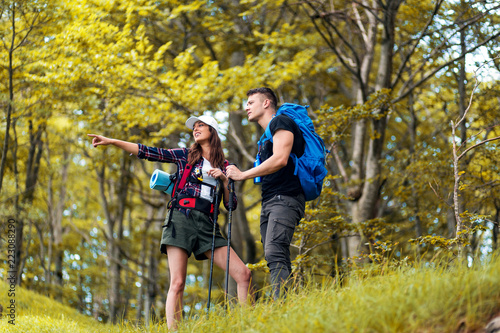 Happy young couple on their hiking trip.Hiking concept