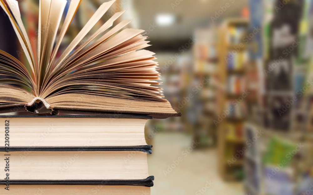 Old stacked books on blurred background Old stacked books on blurred background